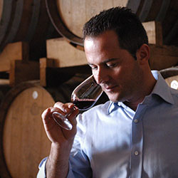 Michele Rigoni, Manager at Rigoni Vittorino, tasting a wine in the cellar