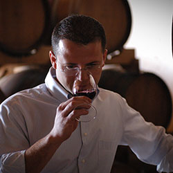 Stefano Rigoni, Winemaker at Rigoni Vittorino, tasting a wine in the cellar