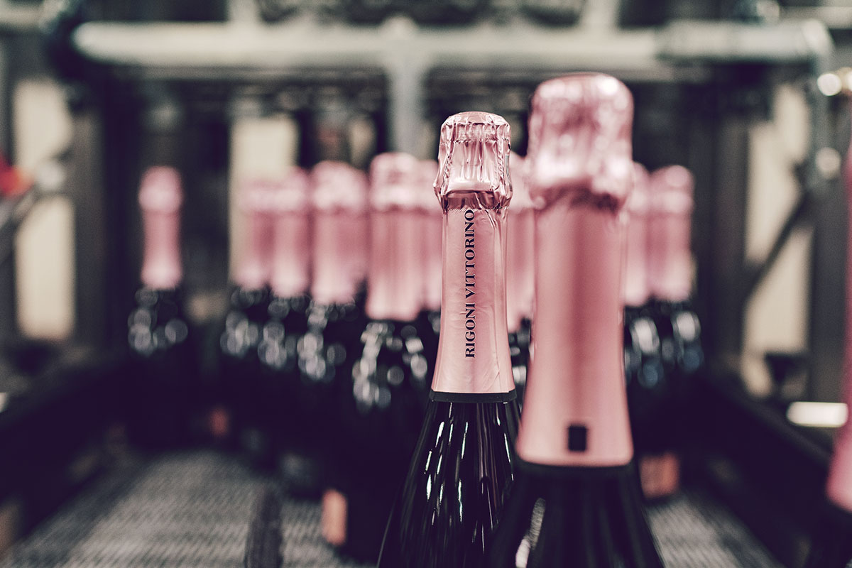 Rosé sparkling wine bottles ready for labeling